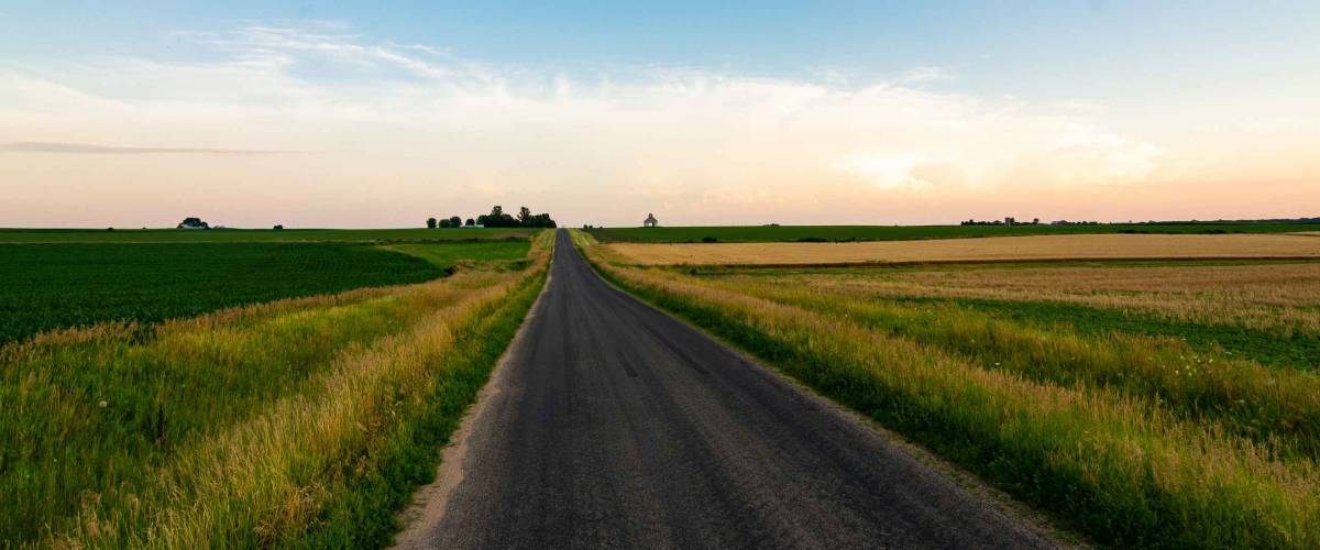 Open country road in rural Illinois as the sun sets. LaSalle County, Illinois, USA